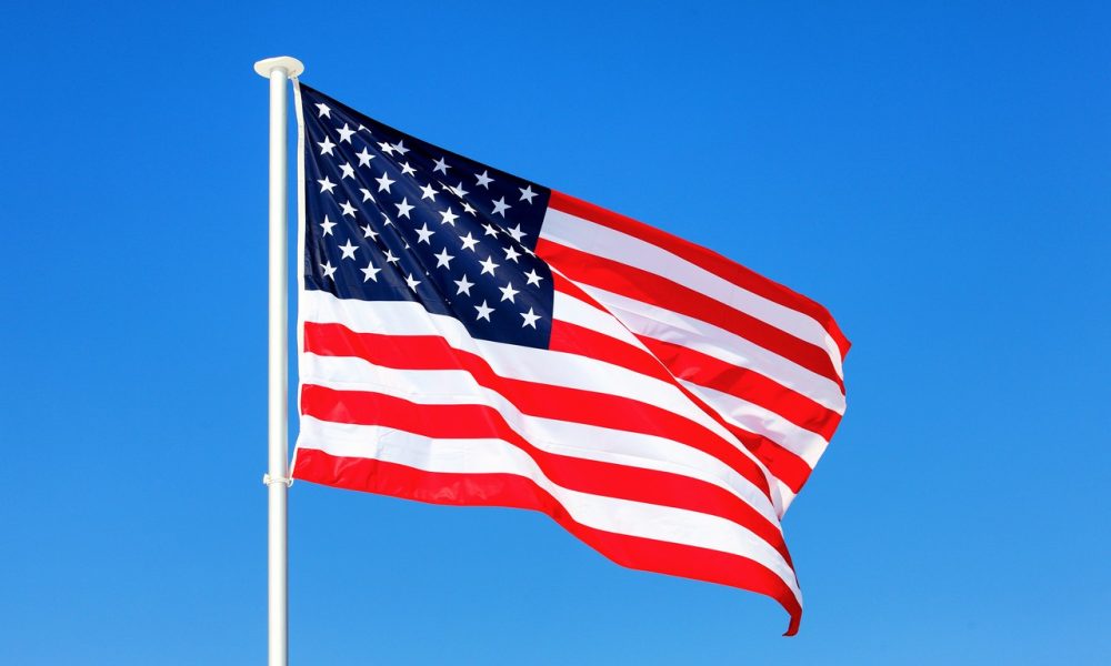 american flag waving blue sky 1