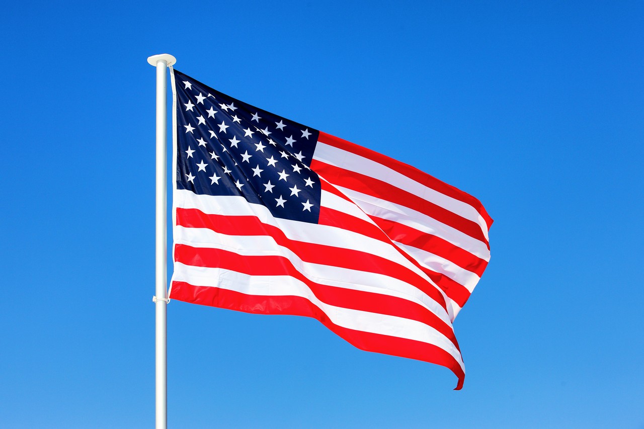 american flag waving blue sky 1
