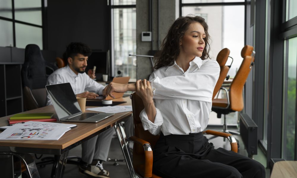 side view woman stretching work