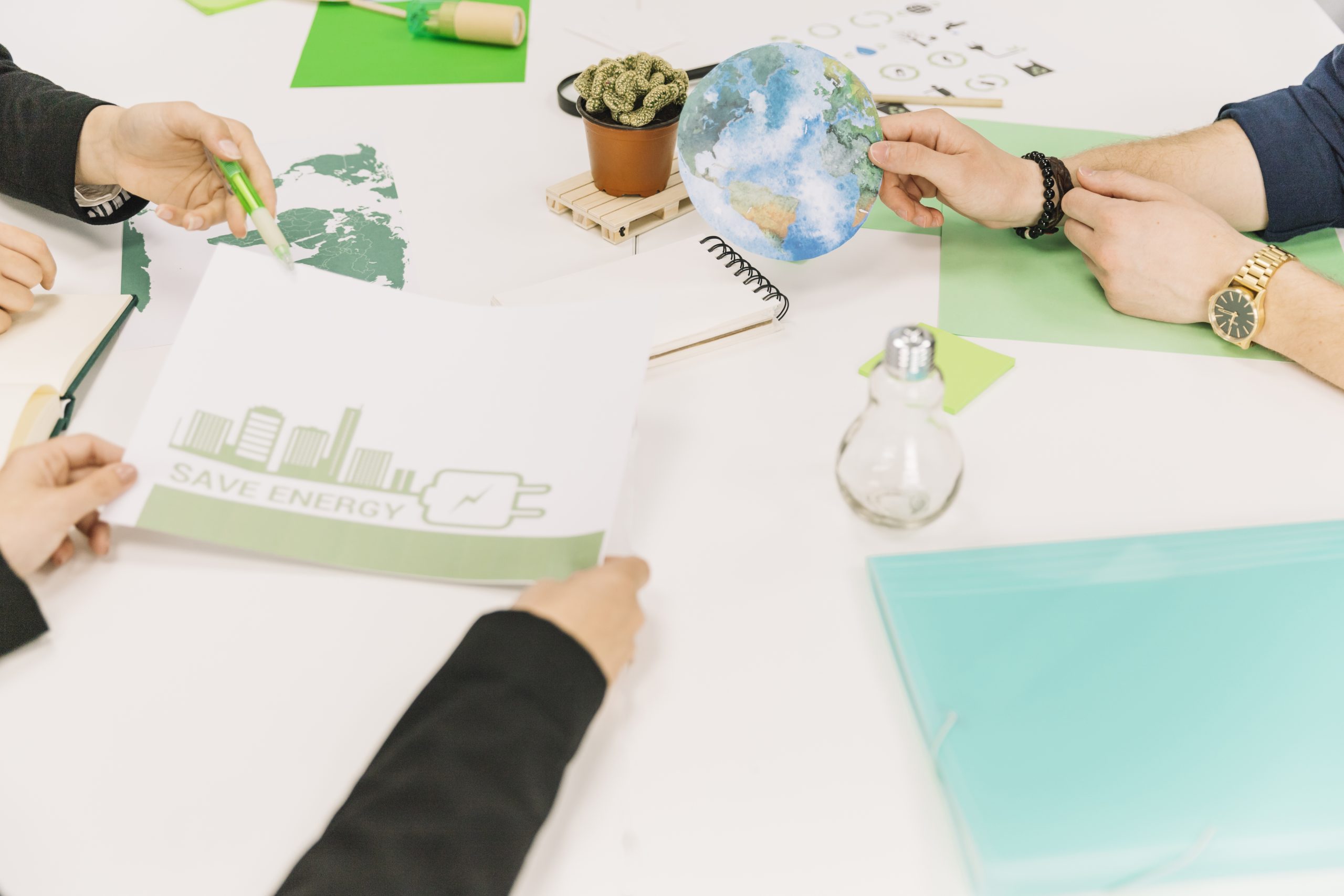 group businesspeople working energy saving desk scaled
