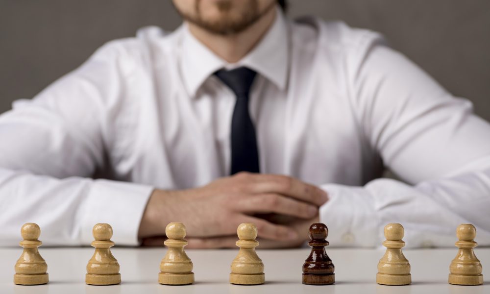 front view business man with pawns
