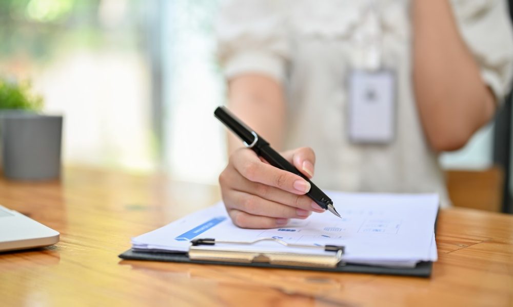 close up image of a female accountant examining fi 2026 03 26 23 59 43 utc