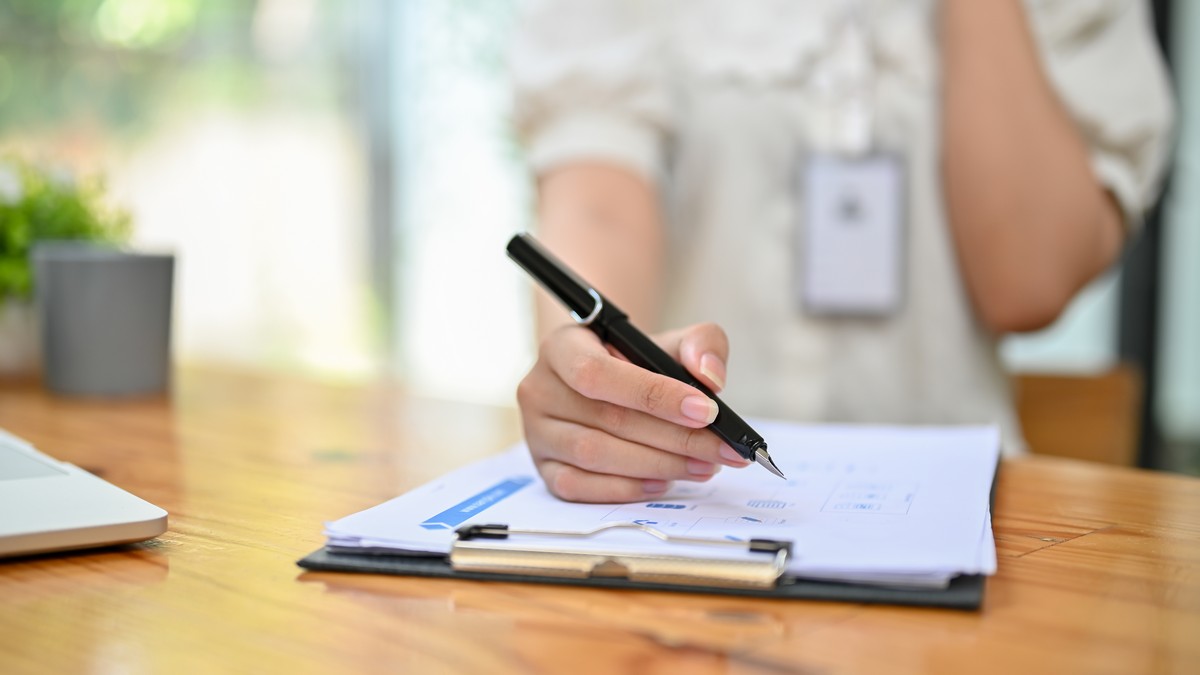 close up image of a female accountant examining fi 2026 03 26 23 59 43 utc